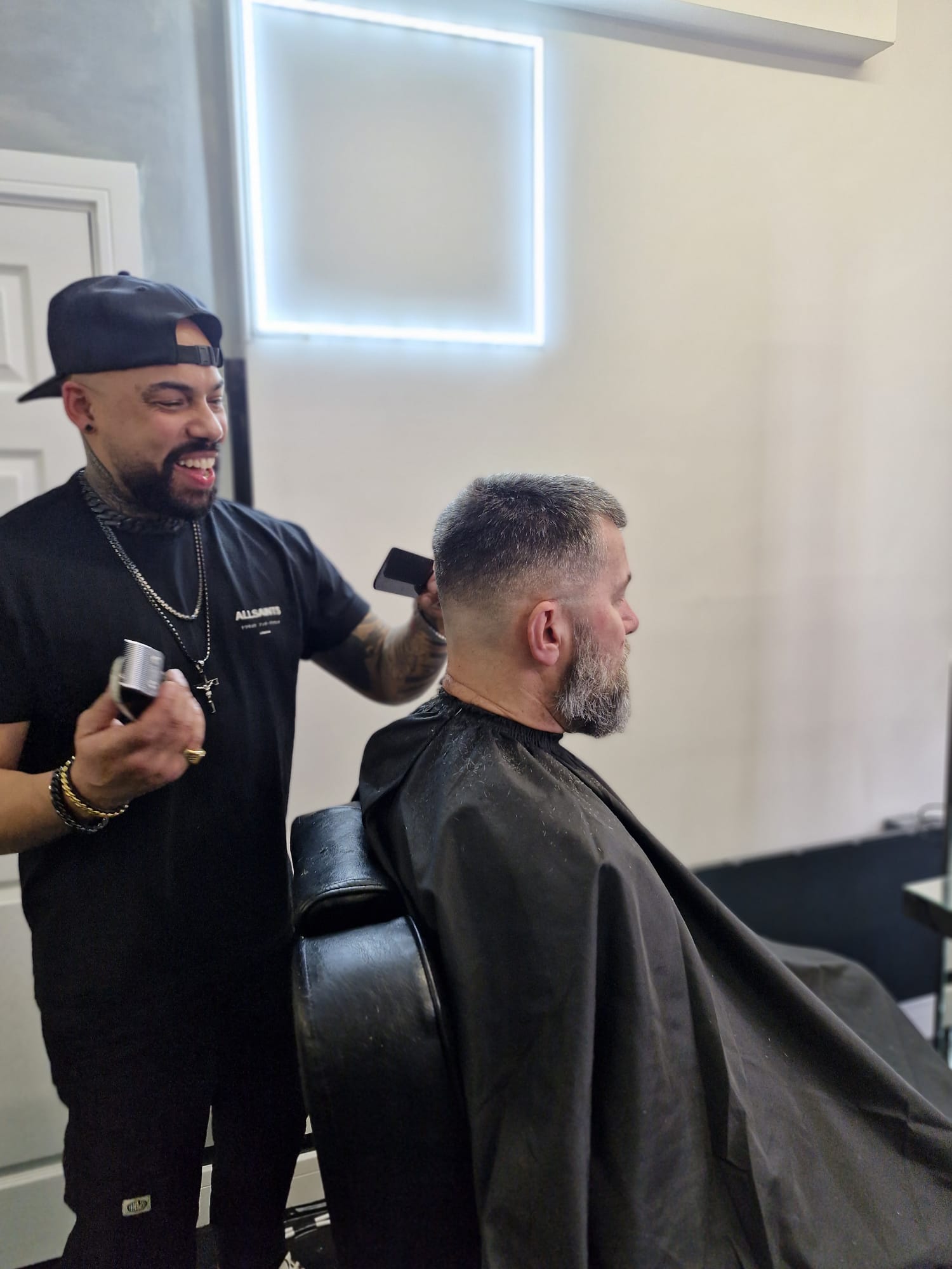 Barber styling a client